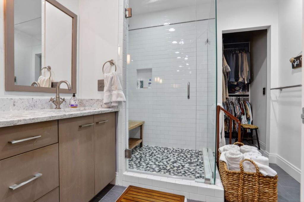 905 Juniper Street Northeast, Unit 403 Atlanta, GA 30309 - Photo 11 of 21 a bathroom with a sink a toilet and shower