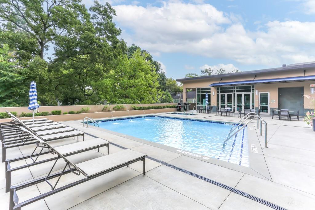 905 Juniper Street Northeast, Unit 403 Atlanta, GA 30309 - Photo 16 of 21 a view of a swimming pool with a lounge chair