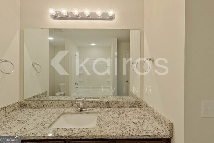 108 St Phillip Way Springfield, GA 31329 - Photo 24 of 29 a bathroom with a sink a mirror and a shower