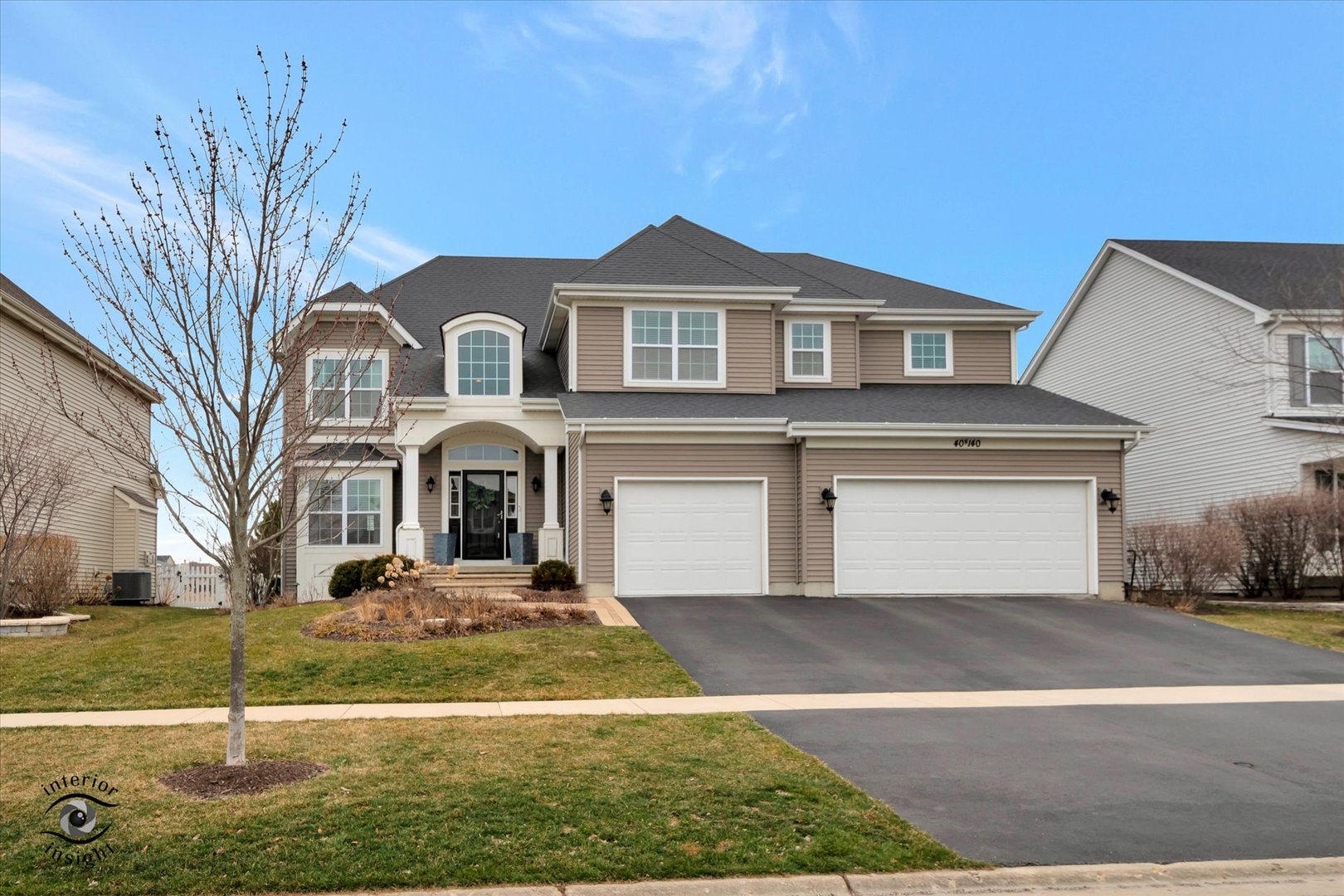 40-w140 Palmer Road Geneva, IL 60134 - Photo 1 of 38 a front view of a house with garden