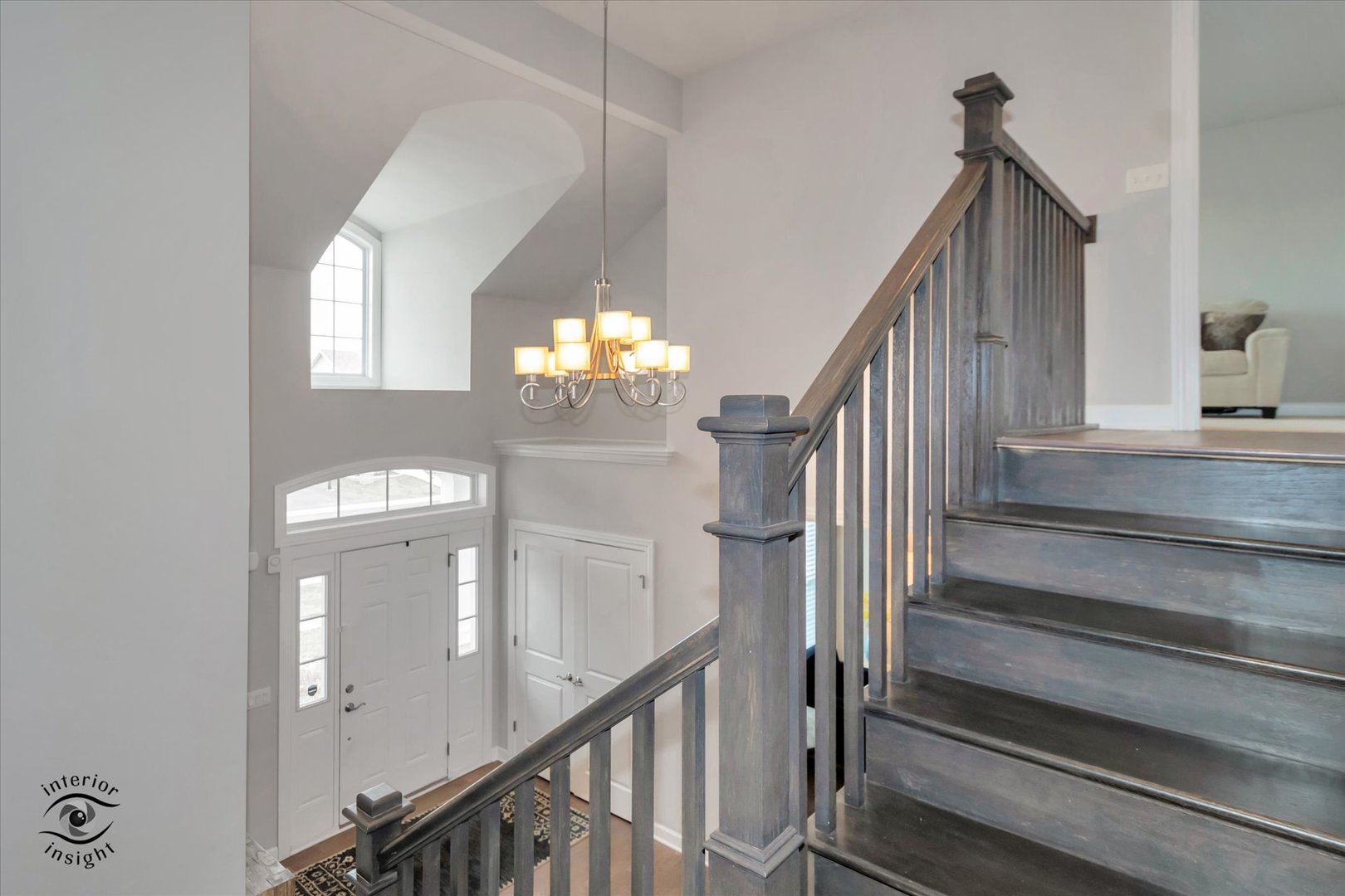 40-w140 Palmer Road Geneva, IL 60134 - Photo 17 of 38 a view of staircase with railing and pendant lights