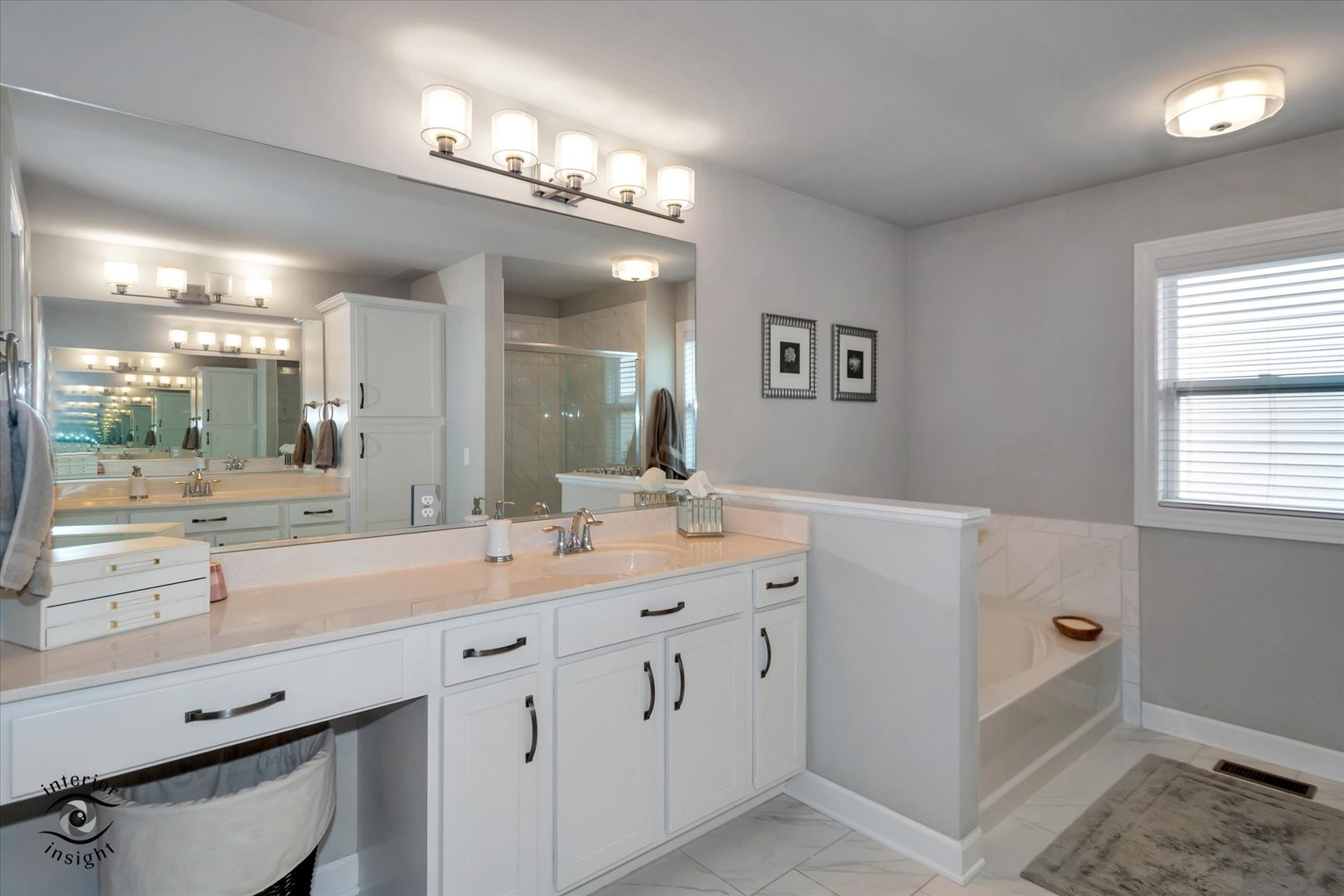 40-w140 Palmer Road Geneva, IL 60134 - Photo 21 of 38 a hall with a sink a large mirror and a vanity