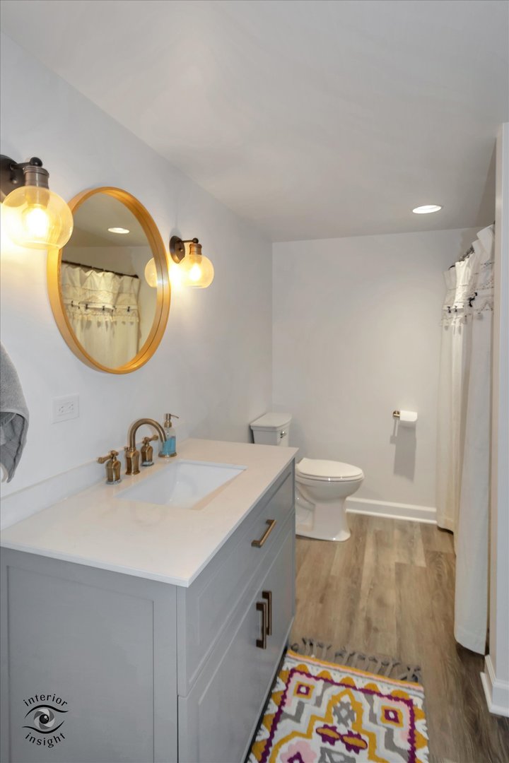 40-w140 Palmer Road Geneva, IL 60134 - Photo 32 of 38 a bathroom with a sink and a mirror