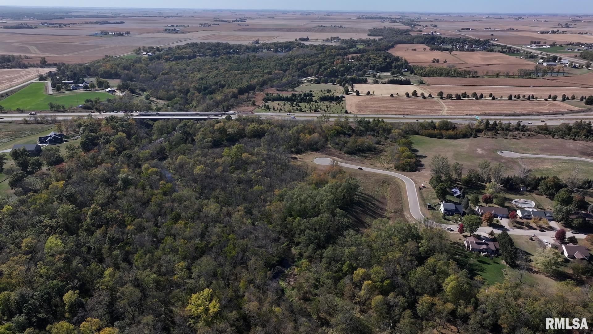 302 Silver Creek Road De Witt, IA 52742 - Photo 11 of 14 an aerial view of residential houses with outdoor space and trees