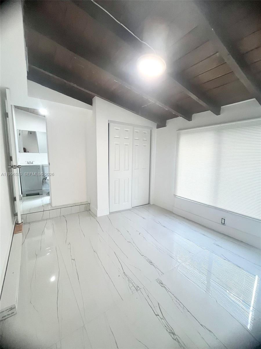 1776 Northeast 178th Street Miami, FL 33162 - Photo 12 of 18 a view of a livingroom with wooden furniture