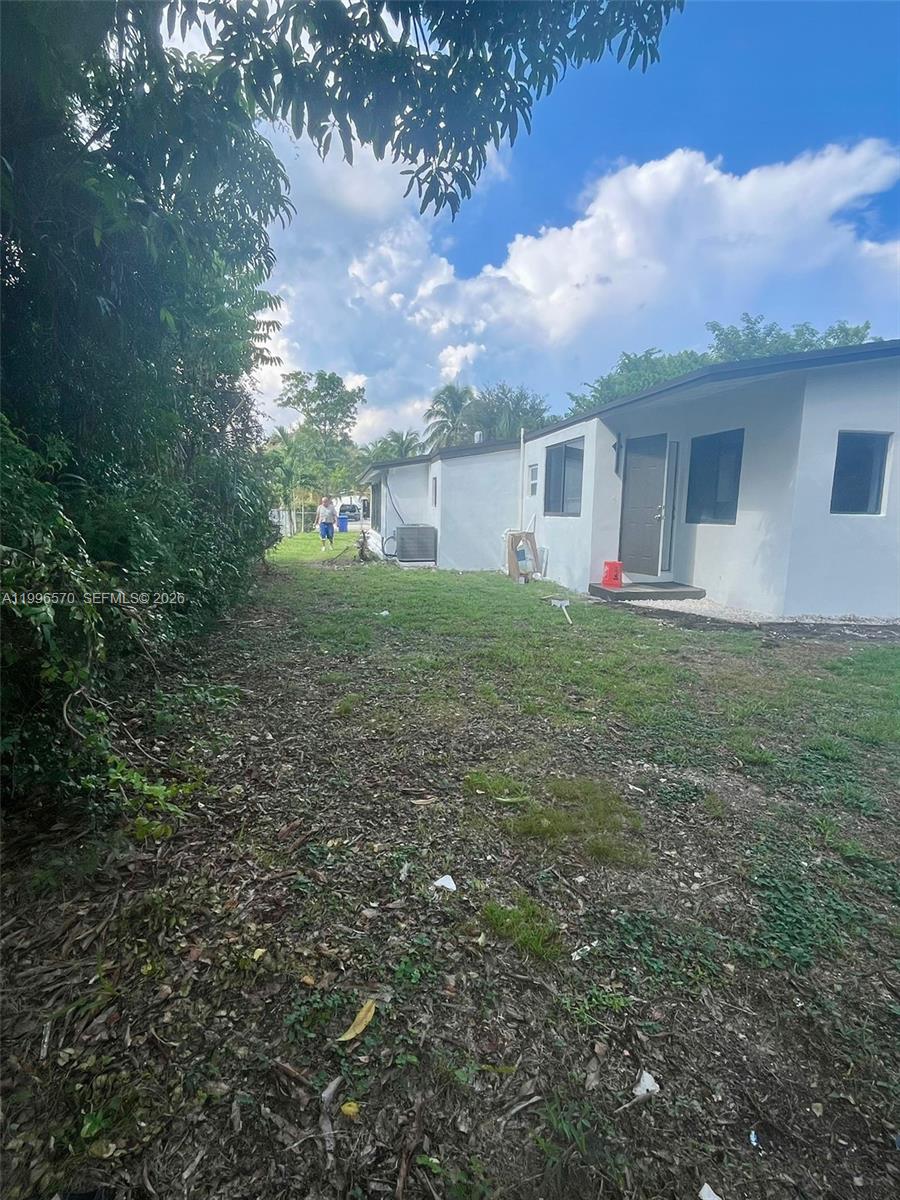 1776 Northeast 178th Street Miami, FL 33162 - Photo 14 of 18 a view of a backyard of the house