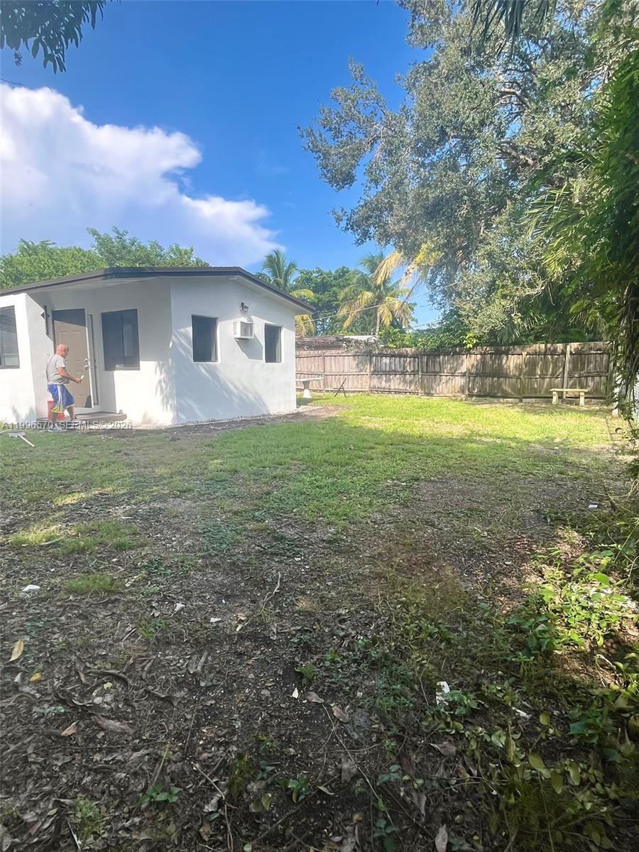 1776 Northeast 178th Street Miami, FL 33162 - Photo 16 of 18 a view of a house with a yard