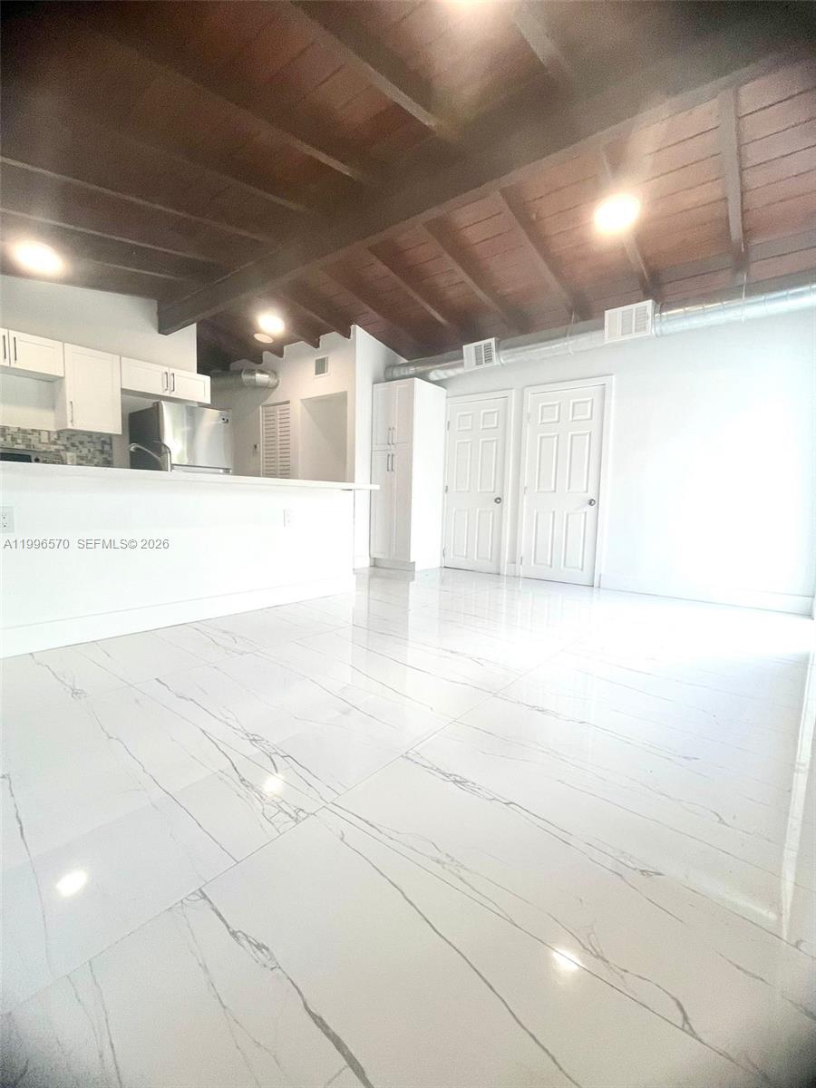 1776 Northeast 178th Street Miami, FL 33162 - Photo 5 of 18 a view of a refrigerator in a room