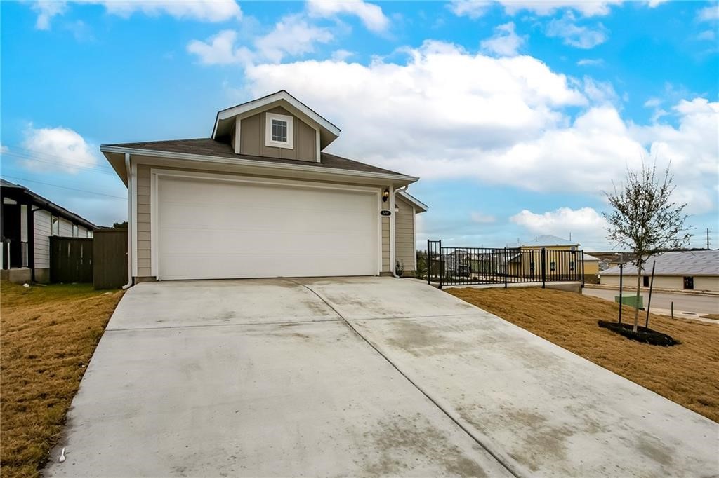 5701 Respinto Drive Austin, TX 78747 - Photo 1 of 1 a front view of a house with a yard and garage
