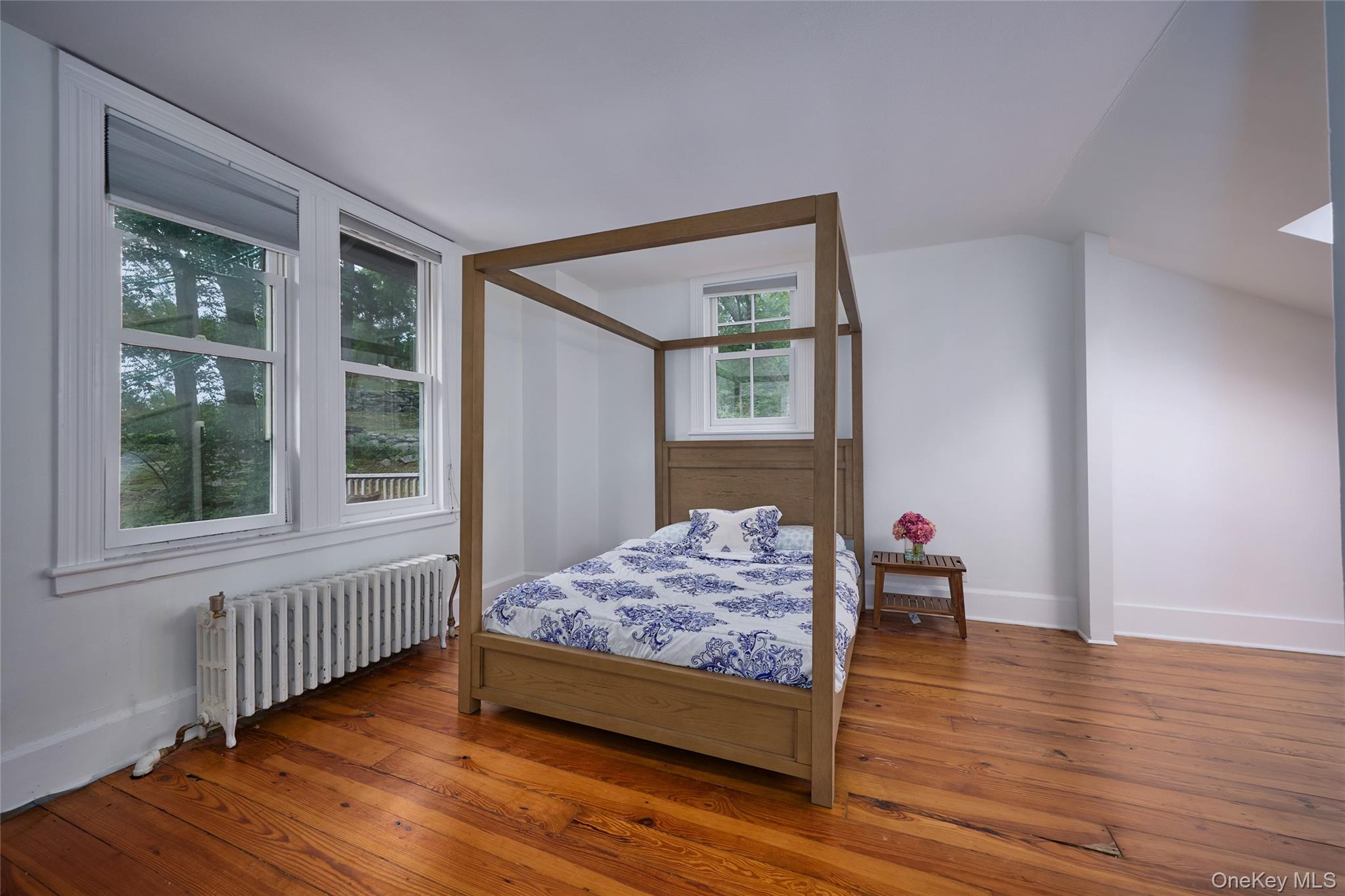 93 Circuit Road Tuxedo Park, NY 10987 - Photo 19 of 34 Bedroom featuring radiator heating unit and hardwood / wood-style floors
