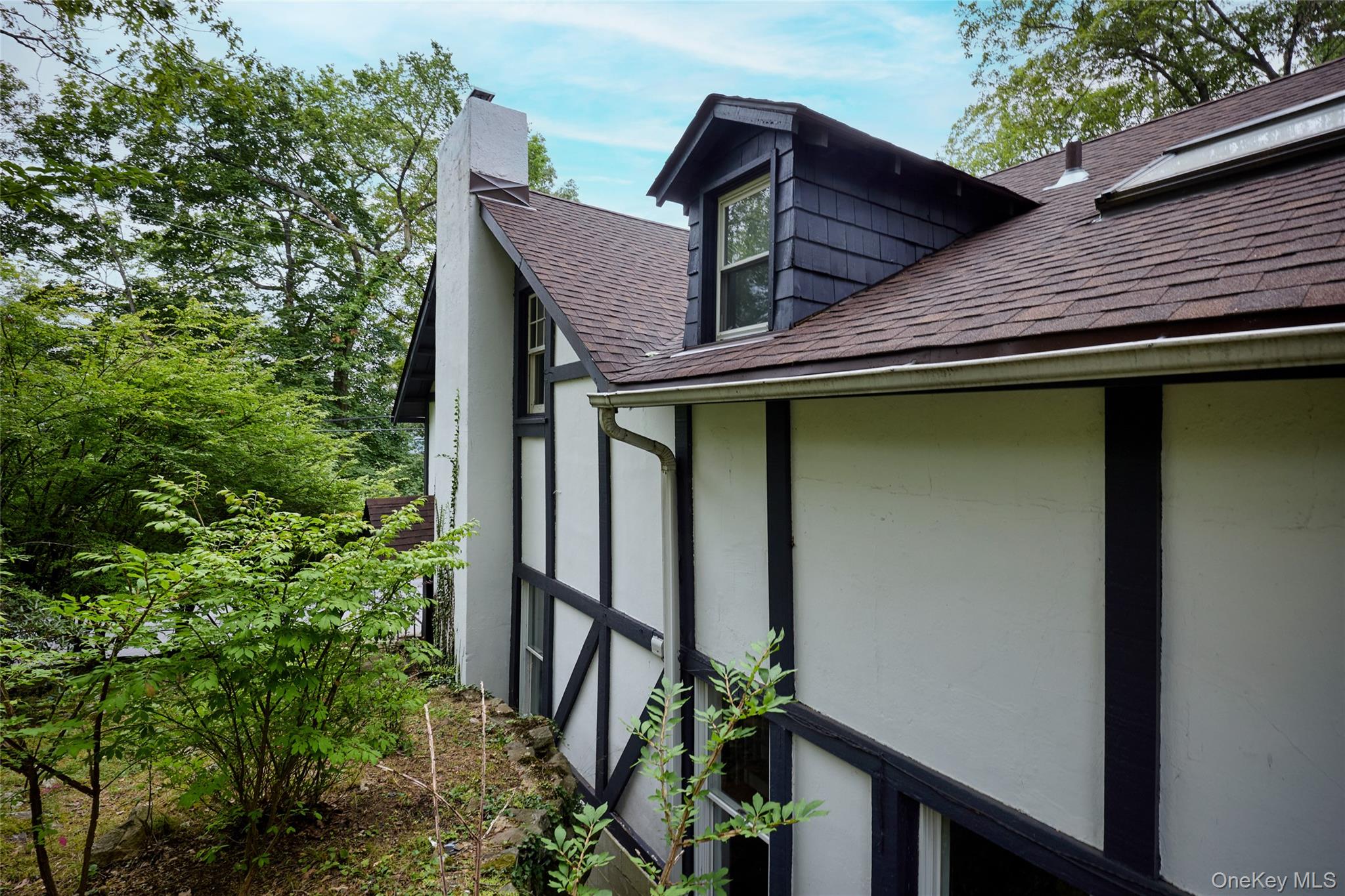 93 Circuit Road Tuxedo Park, NY 10987 - Photo 31 of 34 View of side of property with a shingled roof and a chimney