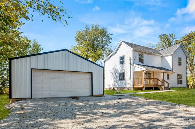 a view of a house with a backyard