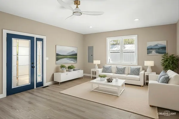 a living room with furniture and a large window