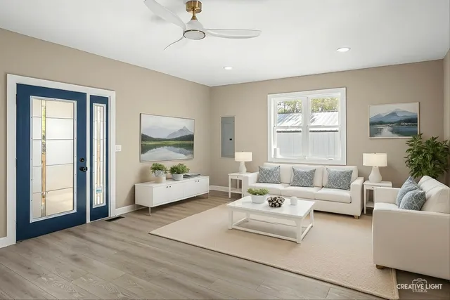 a living room with furniture and a large window