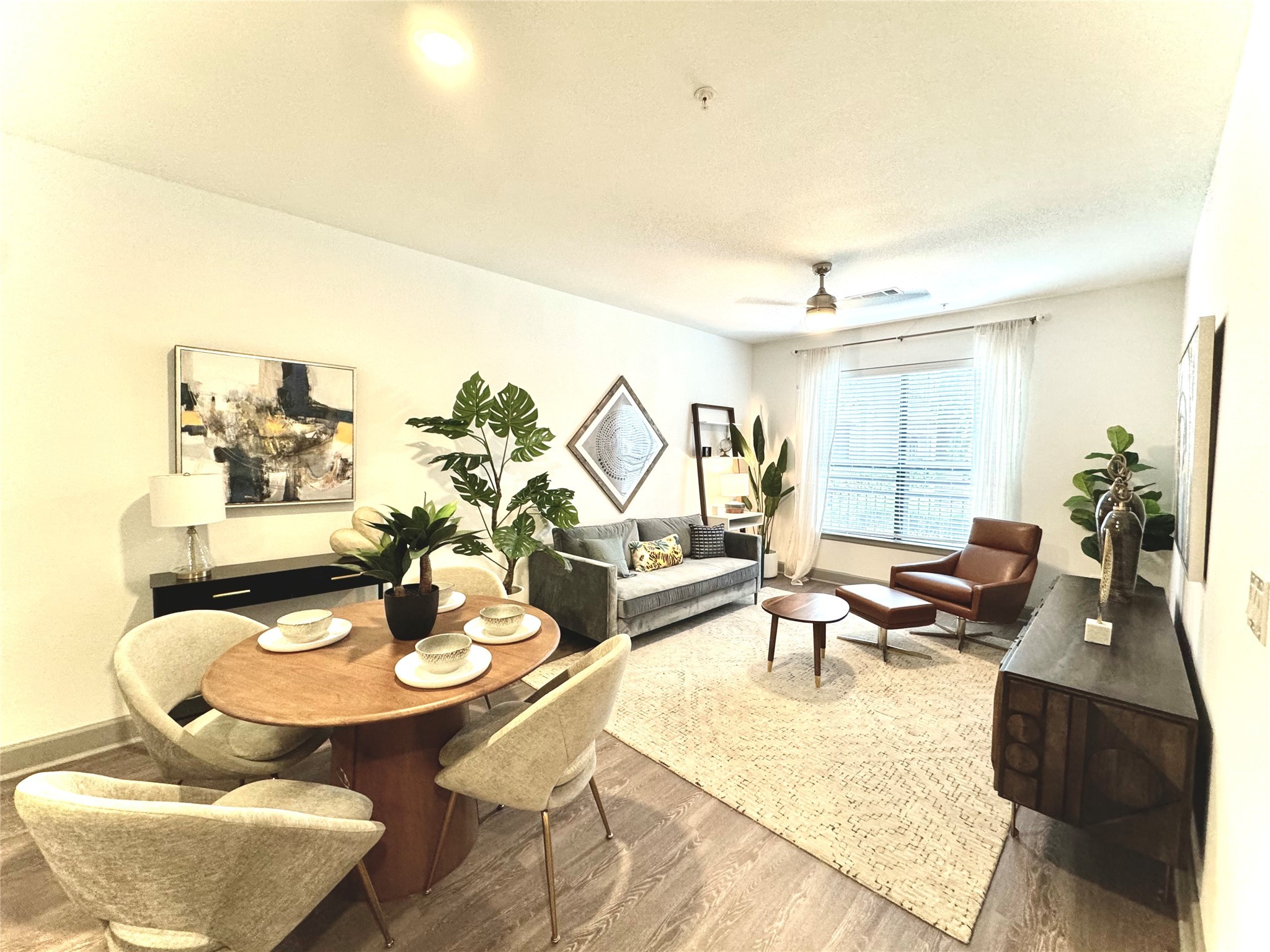 3333 Weslayan Street, Unit 1412 Houston, TX 77027 - Photo 2 of 20 a living room with furniture and a table