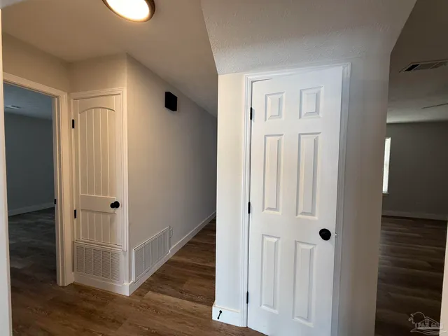 a white toilet sitting next to a bathroom sink and a shower