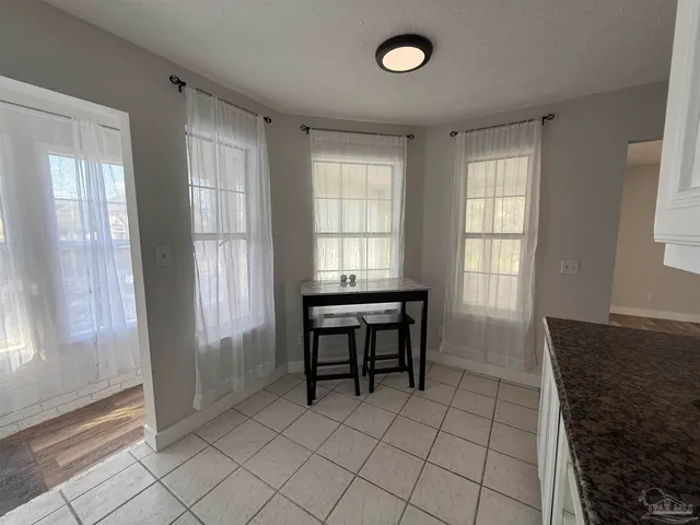 a kitchen with a sink appliances and cabinets