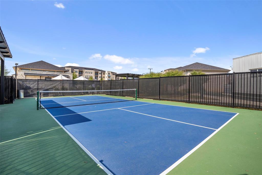 651 Watters Road, Unit 5305 Allen, TX 75013 - Photo 39 of 40 a view of a tennis court with a tennis court
