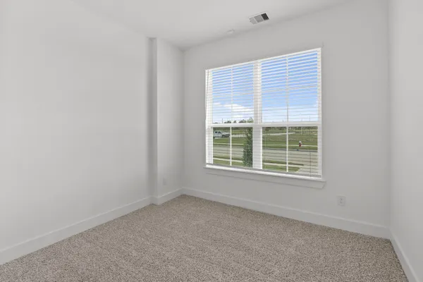 a kitchen with granite countertop a refrigerator and a sink