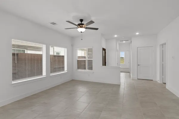a view of an empty room with a window