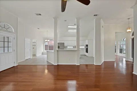 a view of a living room and kitchen with a large window