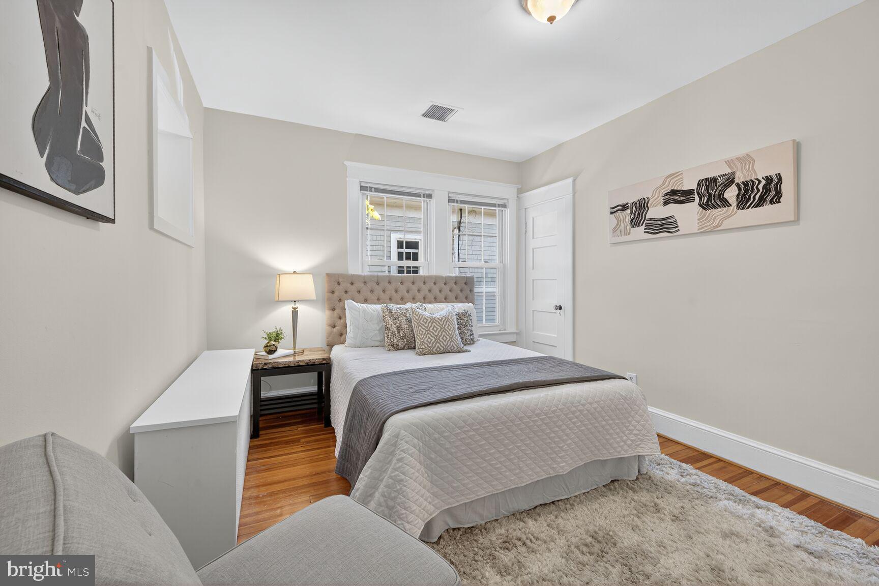 4209 Ellicott Street Northwest Washington, DC 20016 - Photo 21 of 33 a bedroom with a bed and a window