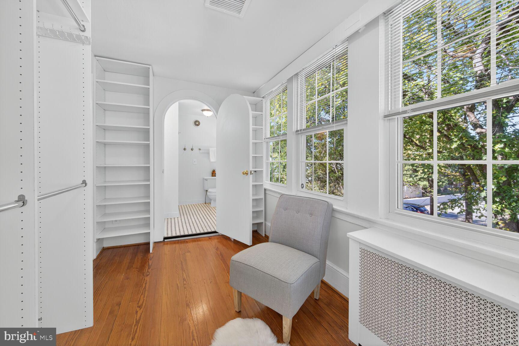 4209 Ellicott Street Northwest Washington, DC 20016 - Photo 22 of 33 a living room with furniture and a window