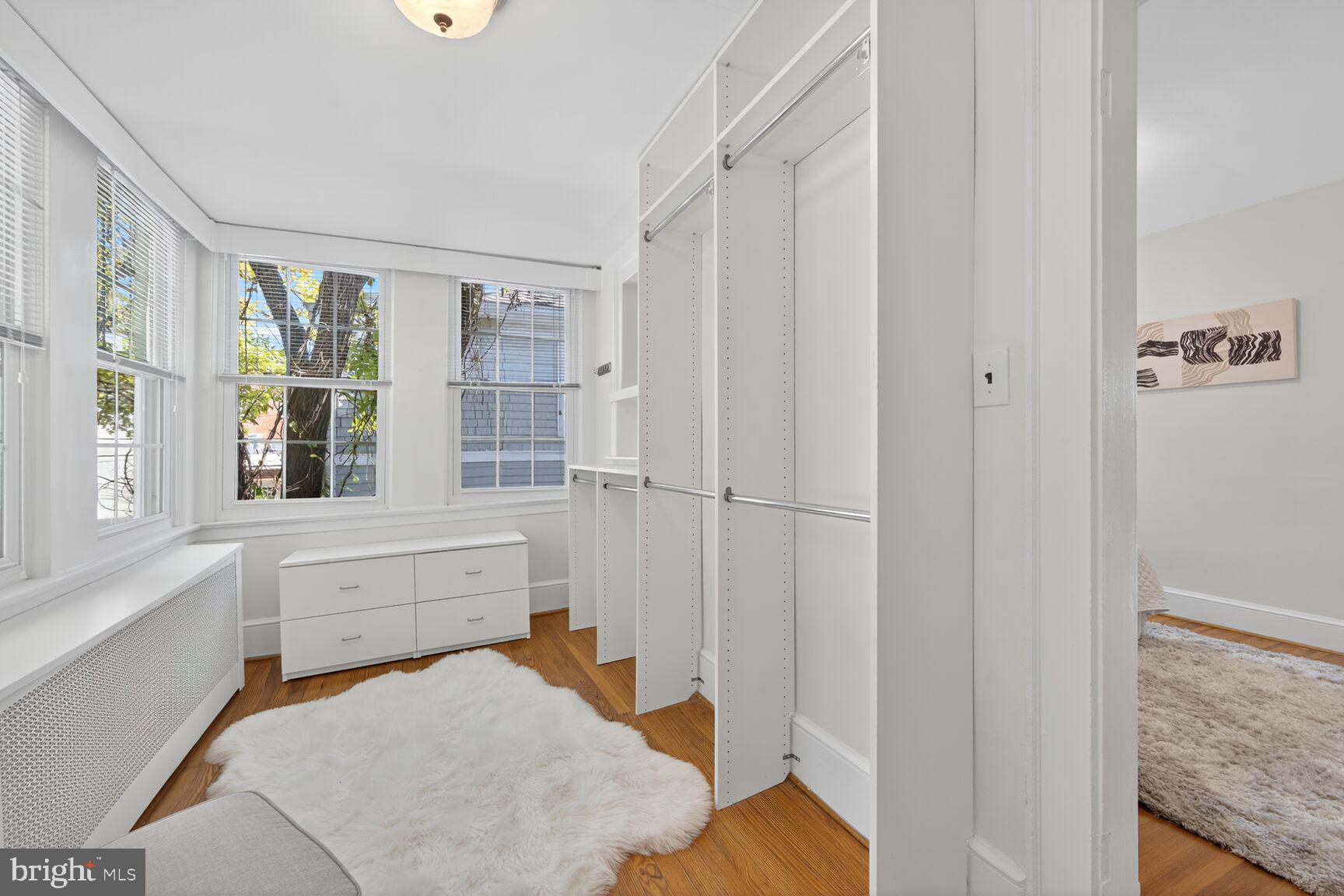 4209 Ellicott Street Northwest Washington, DC 20016 - Photo 25 of 33 a bedroom with a bed and a window with vanity