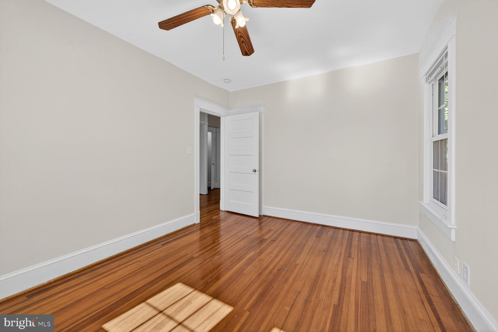 4209 Ellicott Street Northwest Washington, DC 20016 - Photo 28 of 33 a view of an empty room with wooden floor