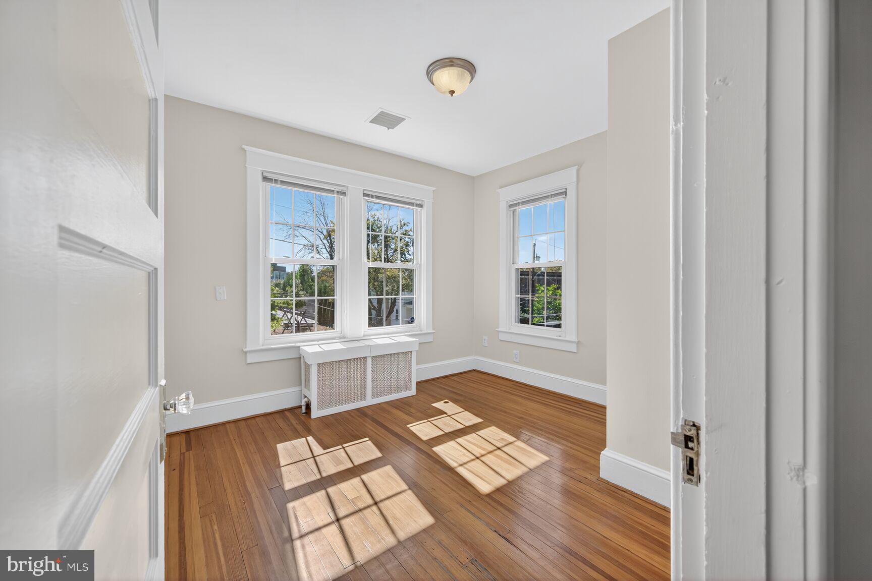 4209 Ellicott Street Northwest Washington, DC 20016 - Photo 29 of 33 a view of a room that has a bed and a window in it