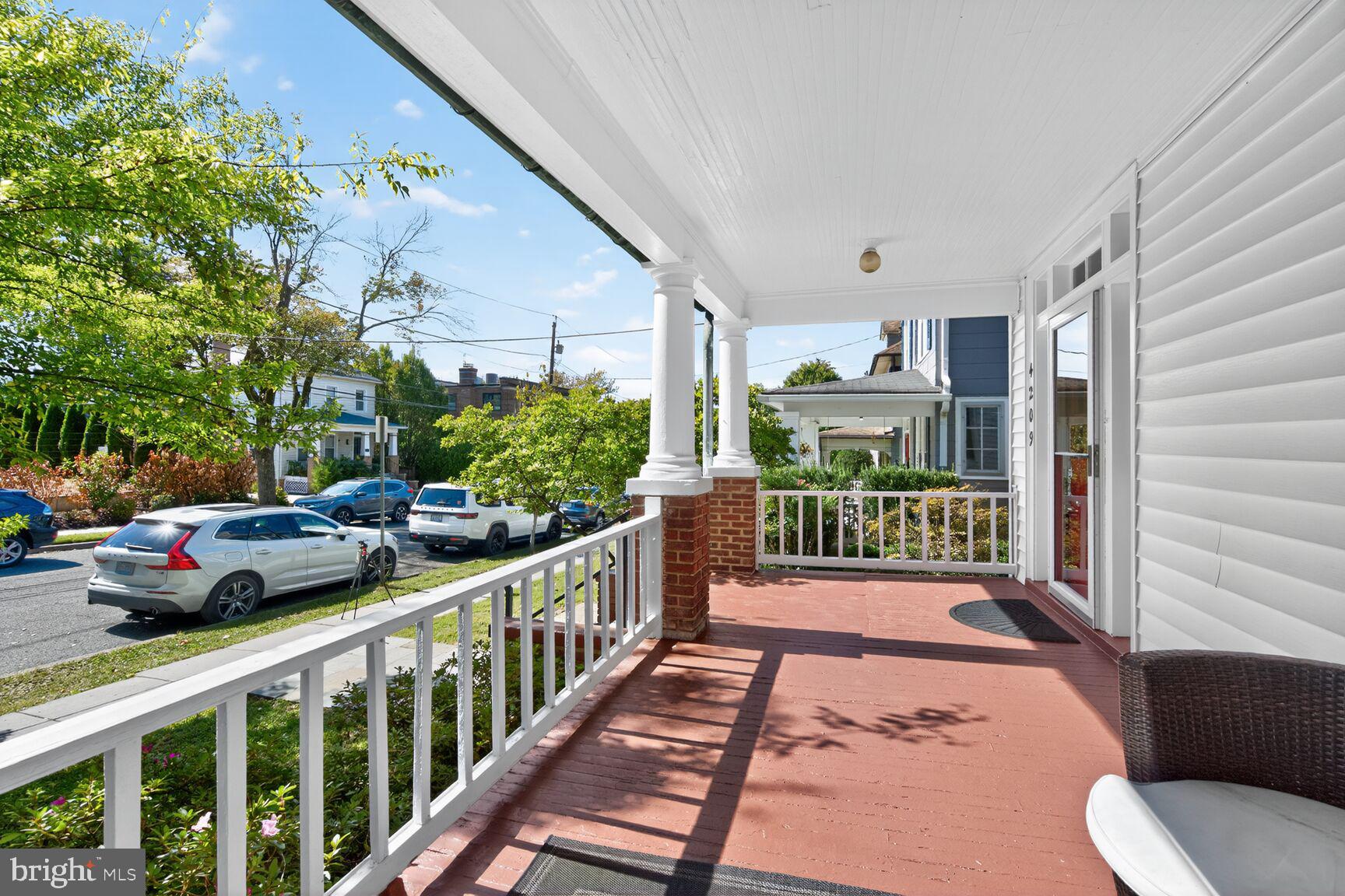 4209 Ellicott Street Northwest Washington, DC 20016 - Photo 3 of 33 a view of a porch with furniture and garden