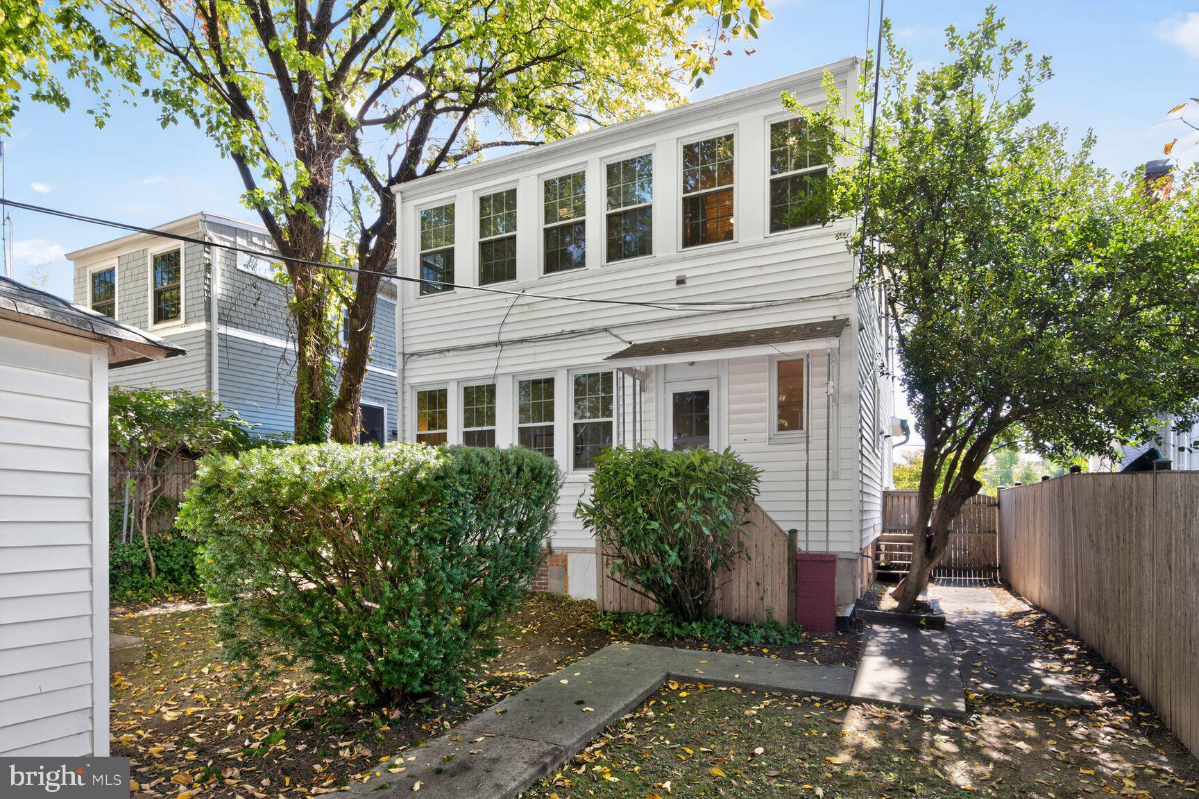 4209 Ellicott Street Northwest Washington, DC 20016 - Photo 32 of 33 a front view of a house with garden