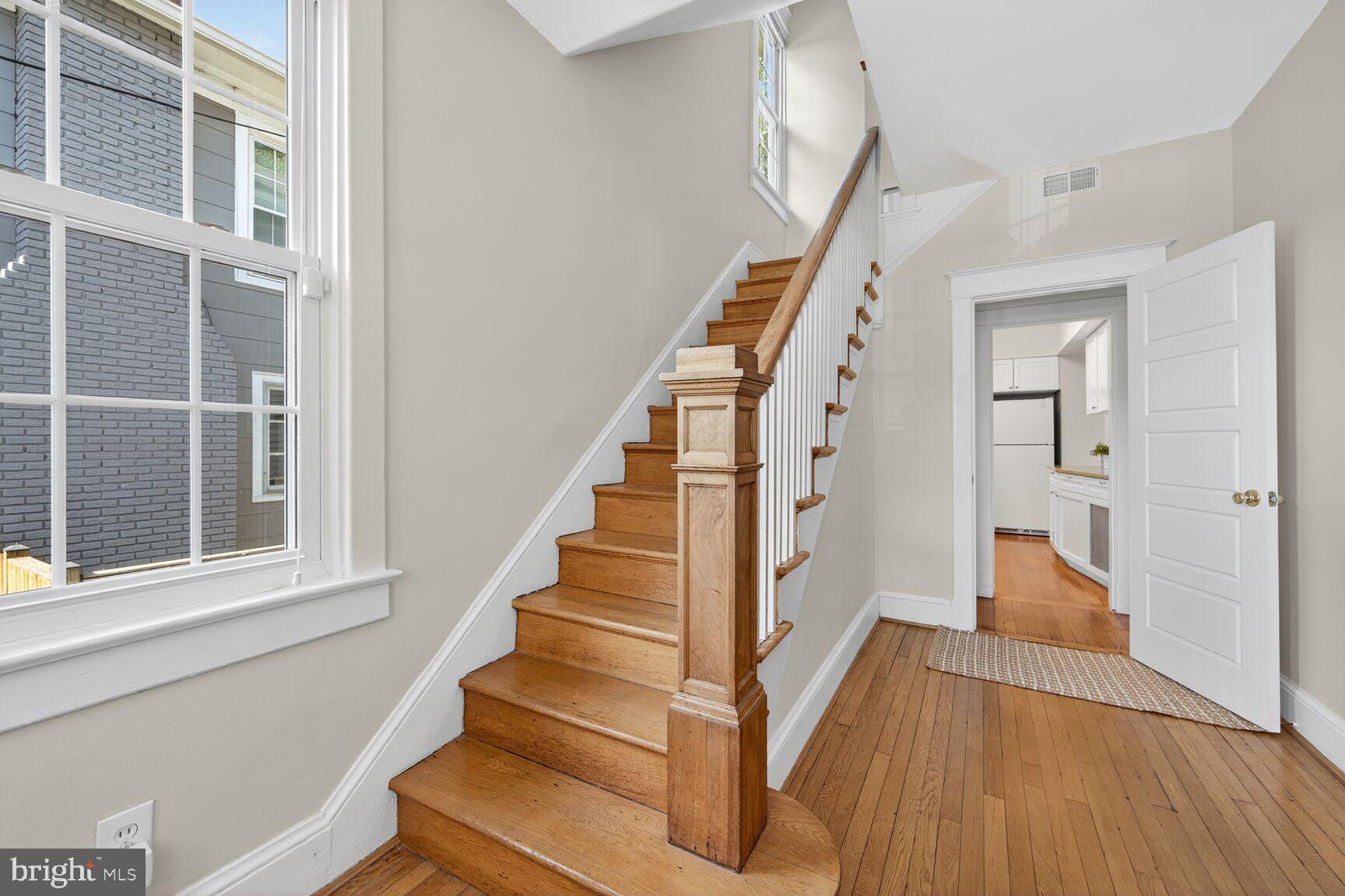4209 Ellicott Street Northwest Washington, DC 20016 - Photo 4 of 33 a view of an entryway with wooden floor and staircase