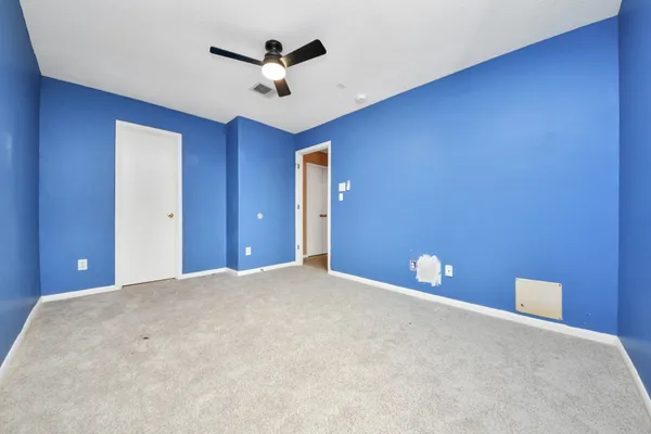 a view of a livingroom with a ceiling fan