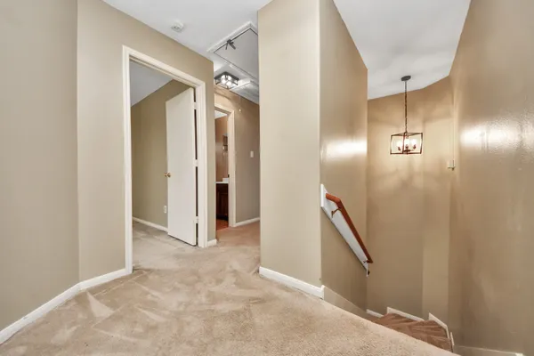 a view of a hallway with hallway and stairs