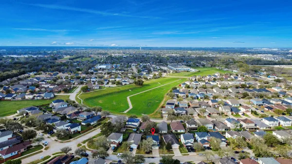 an aerial view of a houses with a outdoor space