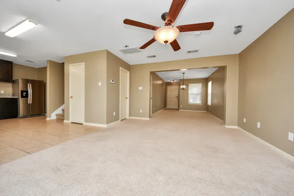 a view of an empty room with a bathroom