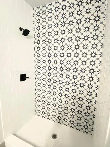 a bathroom with a shower curtain