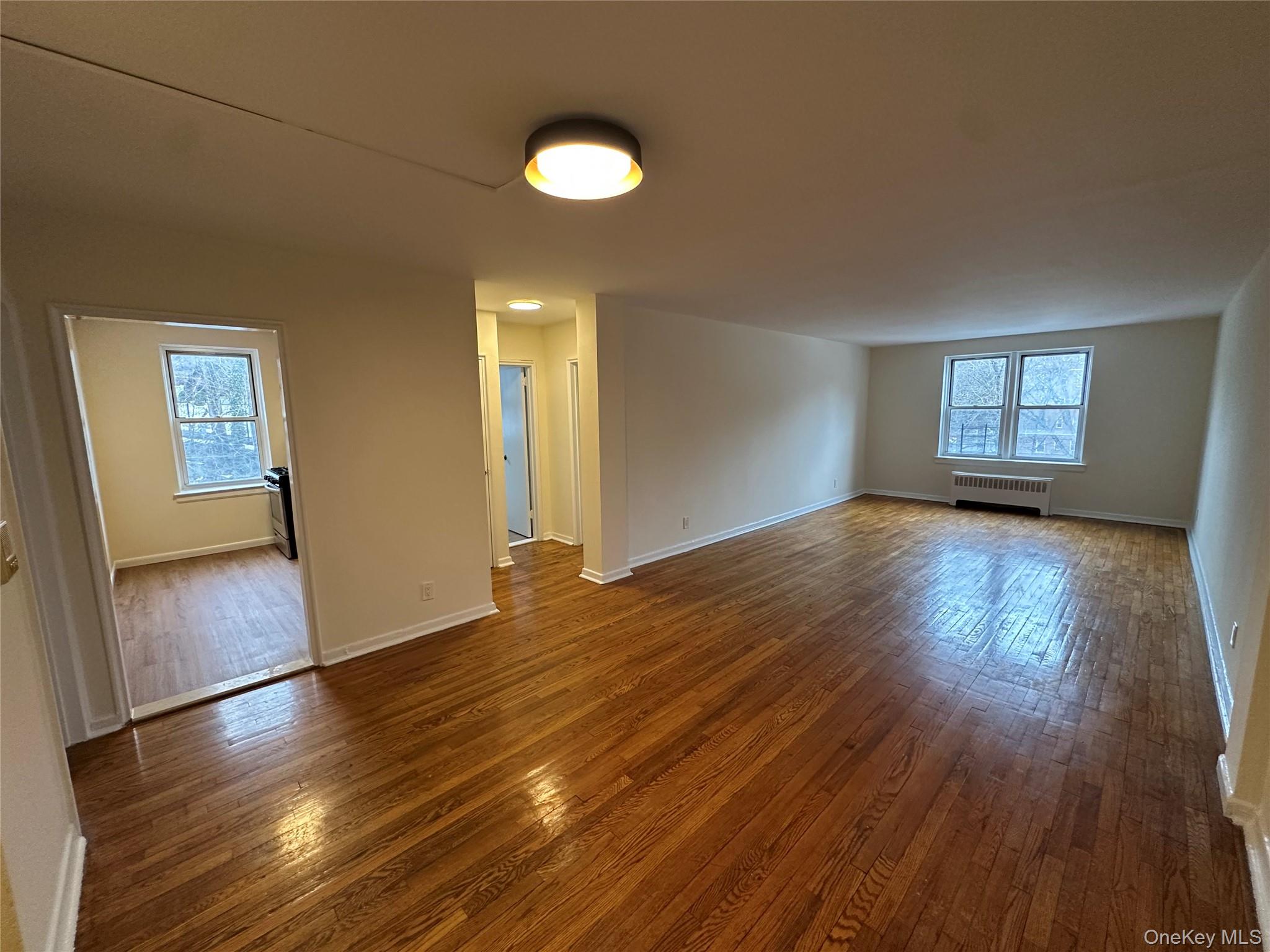 1 Vincent Road, Unit 3K Bronxville, NY 10708 - Photo 18 of 38 View from the dining area space looking into the kitchen and primary bedroom and down toward the living room area