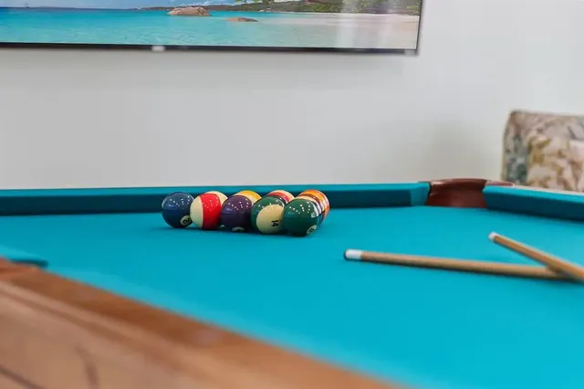 a living room with furniture and a book shelf