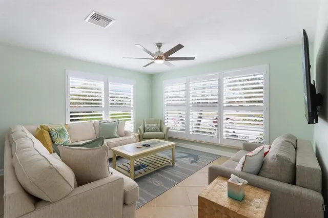 a living room with furniture and a large window
