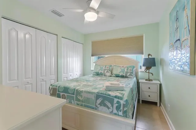 a bedroom with a bed and a cabinets