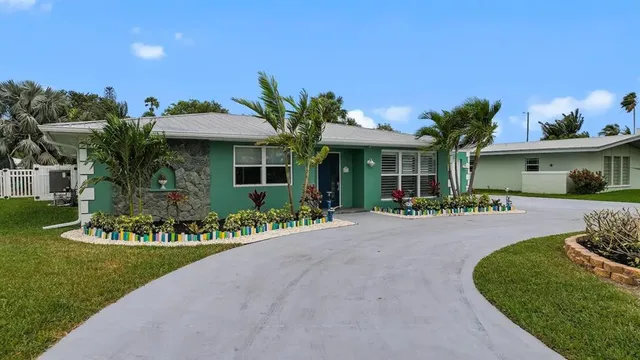 an aerial view of a house with a lake view