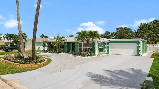a front view of a house with a yard table and chairs