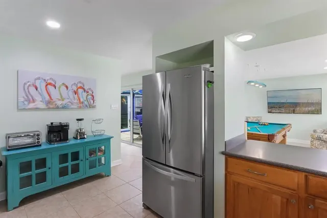a kitchen with stainless steel appliances a refrigerator and a sink