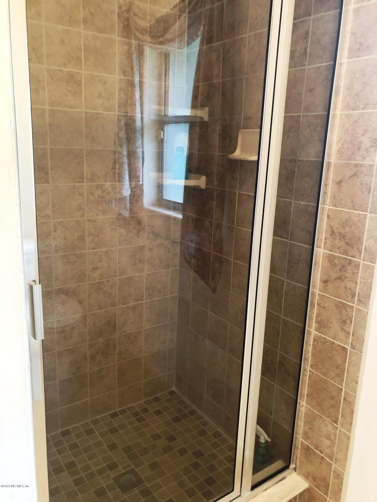 730 North Park Street Crescent City, FL 32112 - Photo 21 of 31 a bathroom with a shower