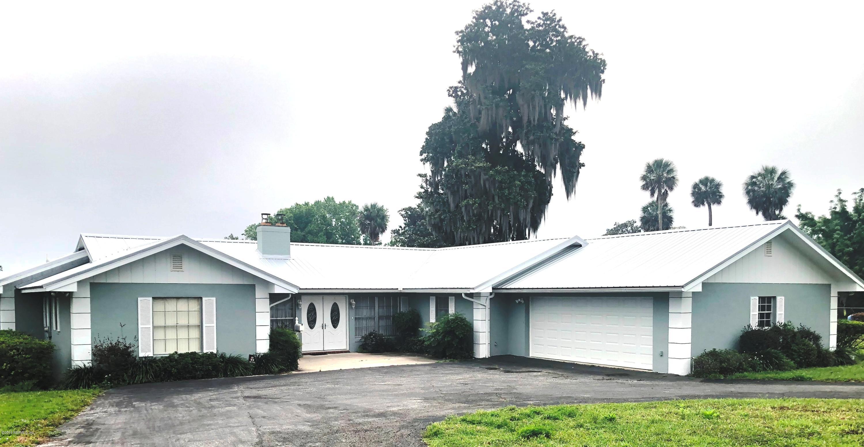 730 North Park Street Crescent City, FL 32112 - Photo 31 of 31 a front view of a house with garden