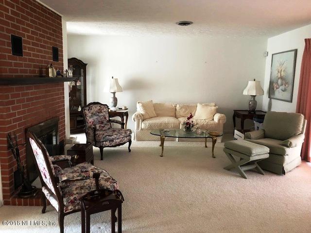 730 North Park Street Crescent City, FL 32112 - Photo 10 of 31 a living room with furniture and wooden floor
