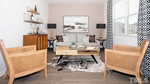 a living room with furniture and a table