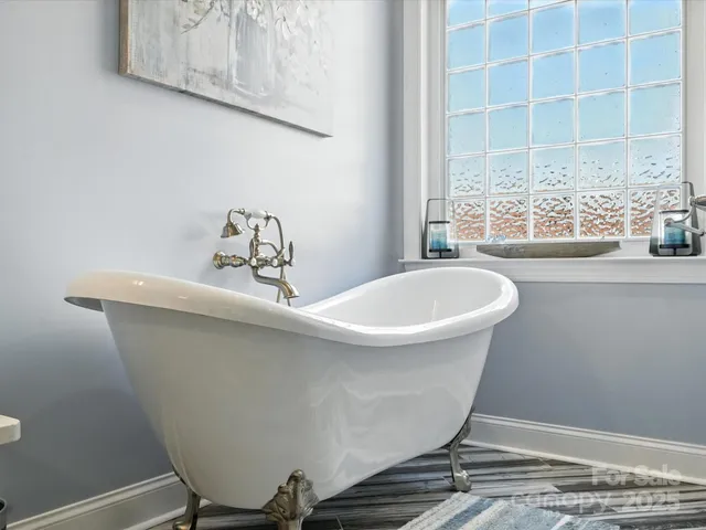 a bathroom with a double vanity sink toilet and a mirror